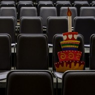 Cut out of a cake on theatre seats